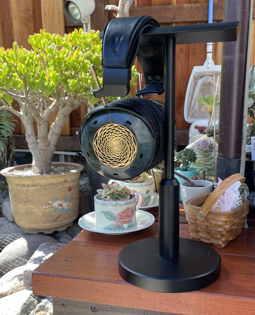 Verite Open on a coffee table next to succulent flowers